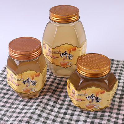金属のふたのガラス蜂蜜の瓶の六角形の形の再生利用できる食糧貯蔵容器 サプライヤー