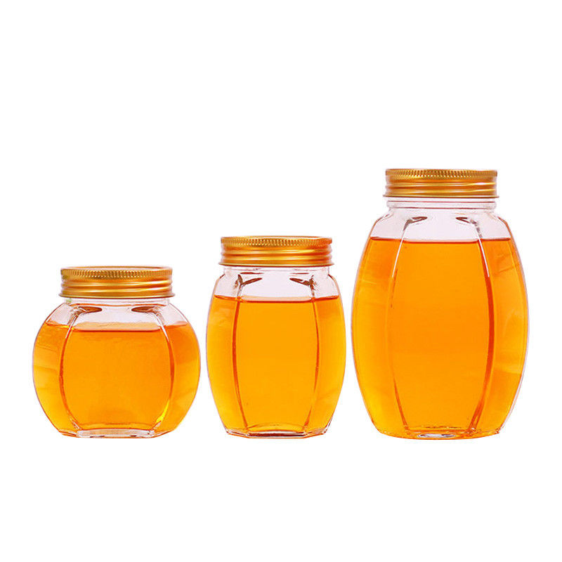 金属のふたのガラス蜂蜜の瓶の六角形の形の再生利用できる食糧貯蔵容器 サプライヤー